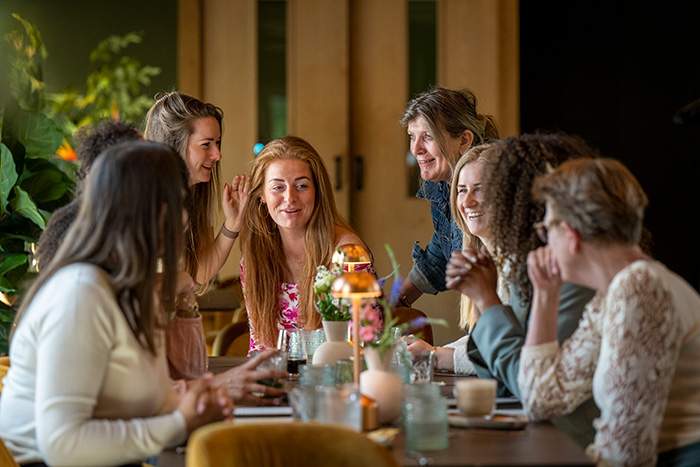 A group of friends at a dinner table